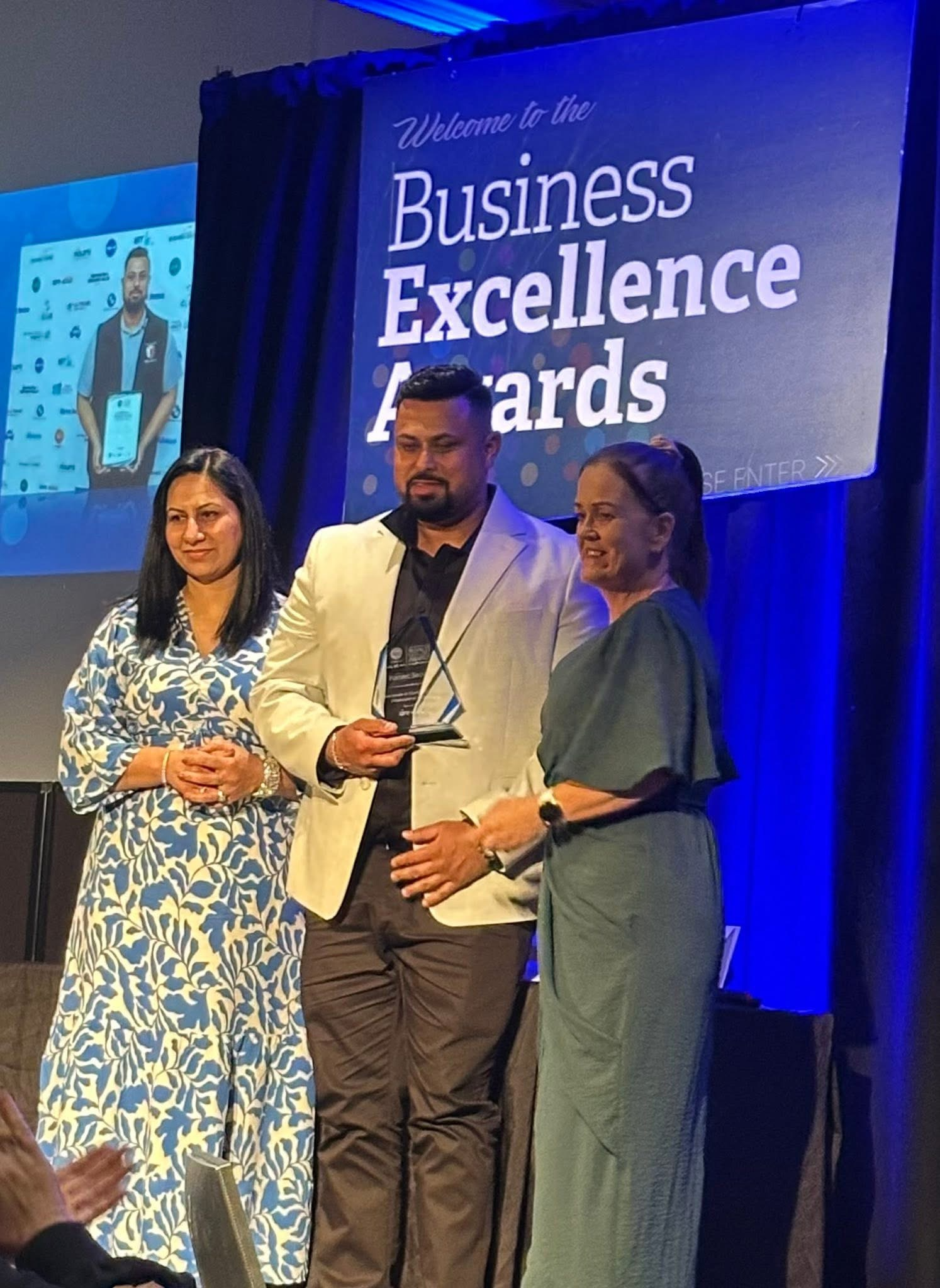Fastsec Security accepting the 2025 SPC Business Excellence Award at the awards night